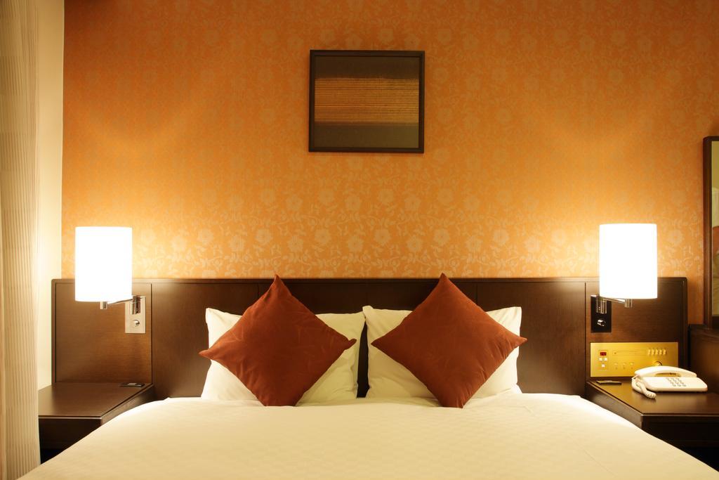 Hotel Granvia Wakayama Ngoại thất bức ảnh A bedroom at the hotel